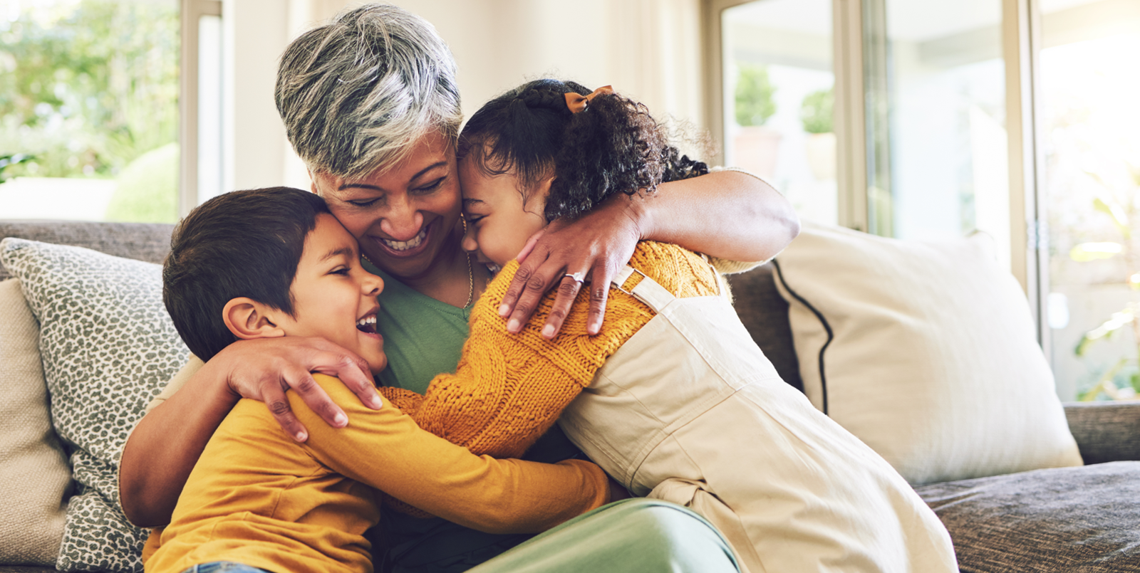 Children embracing caregivier